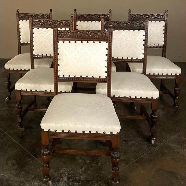 Set of Six Antique Renaissance Dining Chairs feature classic architecture and inspired carved detail for a wonderful Old...