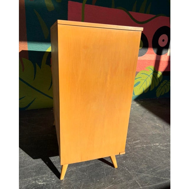 Classic, well-made mid century dresser set by Baumritter. Clean lines, sculpted pulls, tapered legs. Set includes the tall...