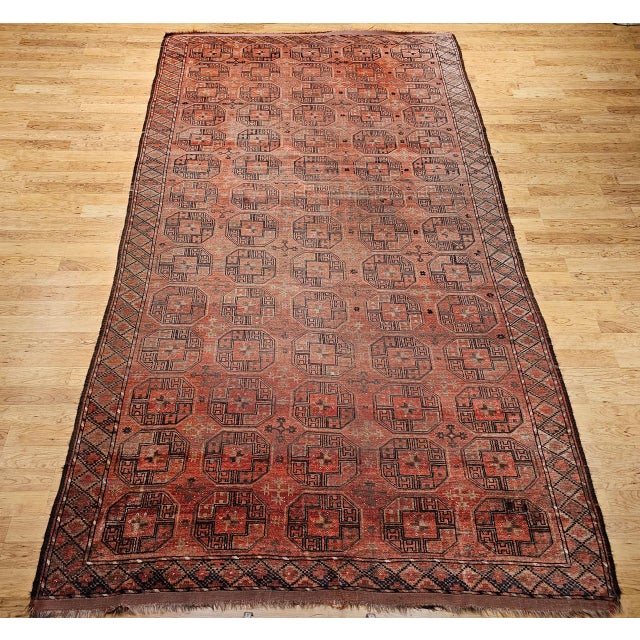 Discover the rich tribal artistry and enduring legacy of this magnificent Early 20th Century Vintage Turkmen Tekke Gallery...