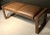 Loren Marsh design bench. New York 2000s. Embossed and stitched leather. Polished stainless steel. Unsigned. This popular...