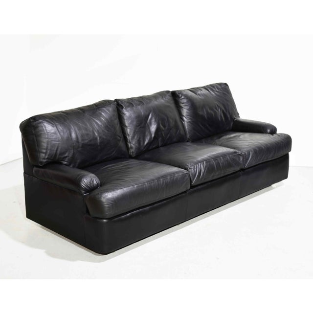Timeless, sophisticated, and exceptionally well-crafted, this vintage black leather 3-seater sofa by Hancock &amp; Moore...