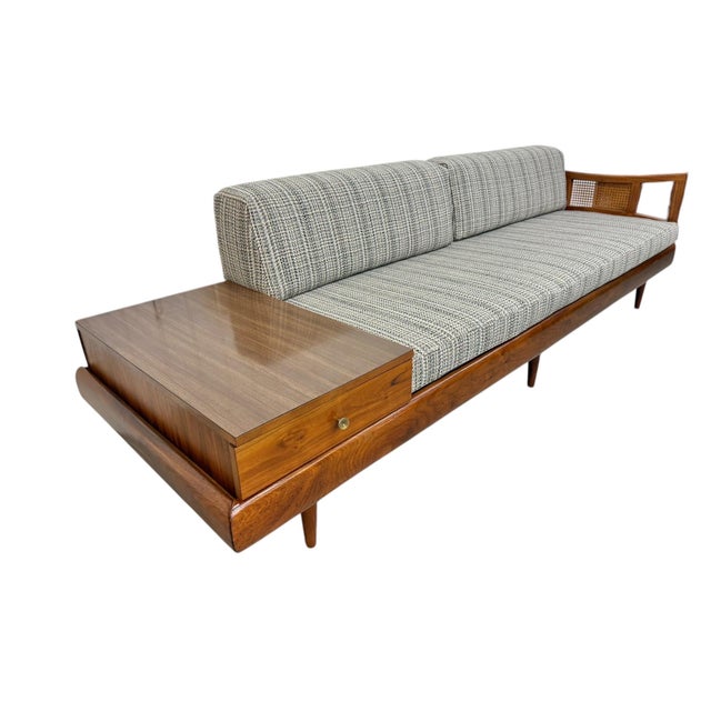 Elevate your space with this iconic Mid-Century Modern sofa designed by Adrian Pearsall, a true statement of sculptural...