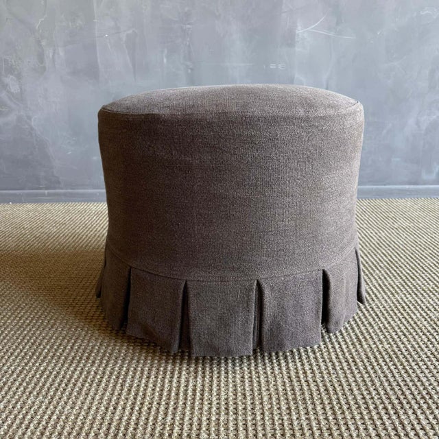 Introducing the Bailey Round Ottoman, with elegant white oak legs finished in a medium tone. Covered in a sophisticated...