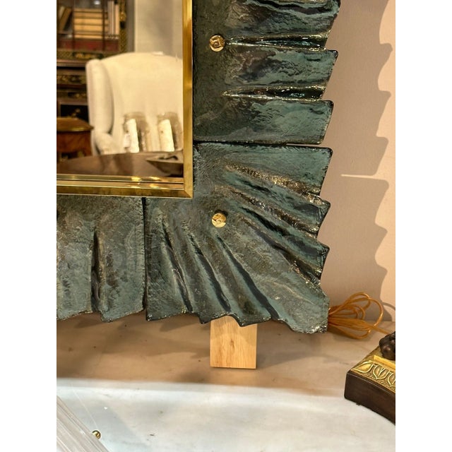 Fabulous fontana green Murano glass fold mirror. Beautiful glistening glass with brass accents. Gorgeous. Note: We have 3...