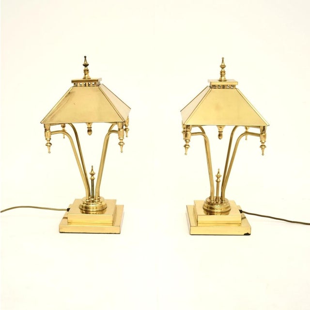 A stylish and extremely well made pair of vintage brass table lamps, made in England and dating from the 1970’s. They are...