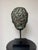 A striking Grand Tour-style head of Zeus, rendered with powerful classical features and a richly developed verdigris...