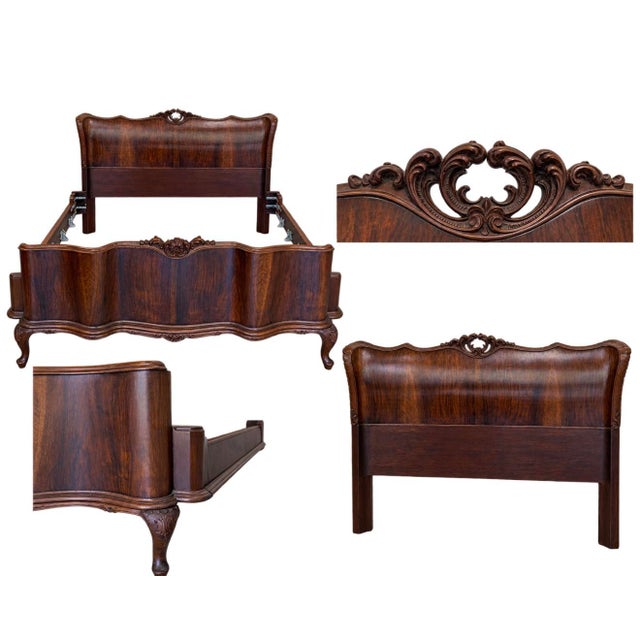 An exceptional early 20th-century (circa 1910) Italian antique bed frame. Masterfully crafted from rich Italian walnut and...