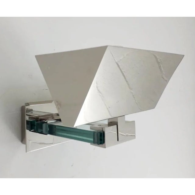 Vintage original Italian wall lights with large geometric chrome shades and back plates mounted with thick beveled glass...