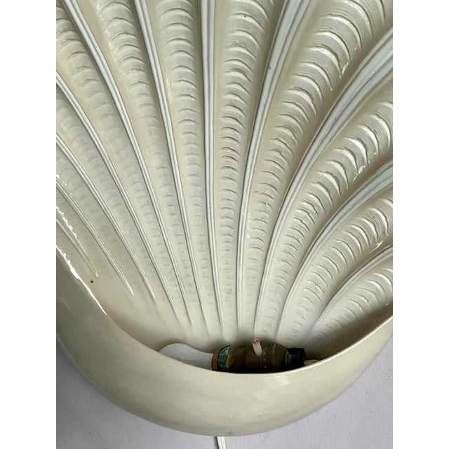 Evoke the serene elegance of the seaside with this exceptional vintage clamshell wall sconce. Crafted in the 1970s, this...