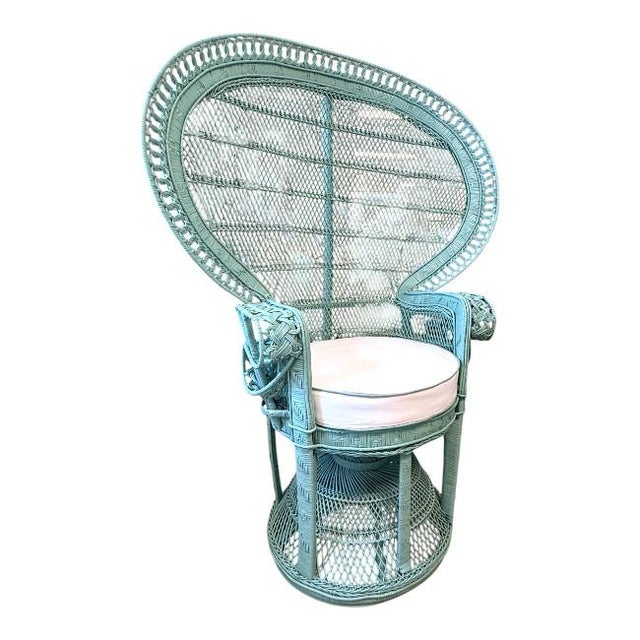 A striking vintage peacock rattan chair in Southfield Green (HC-129, Benjamin Moore). This classic design features an...