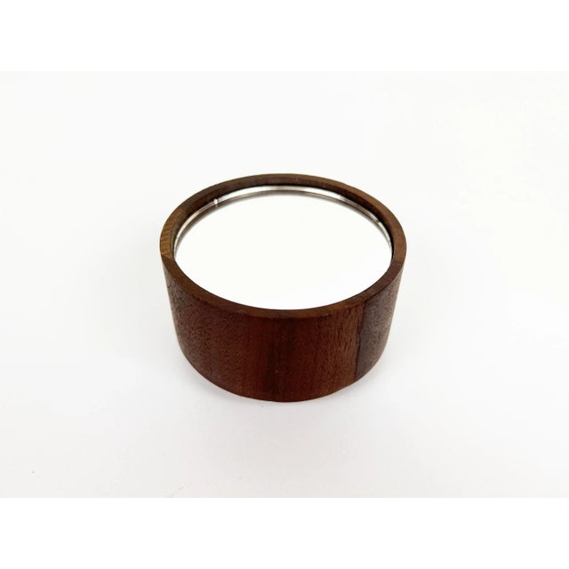 Vintage round mirrored paperweight cased in walnut with a felt bottom. Year: 1970s Style: Mid Century Modern Dimensions:...