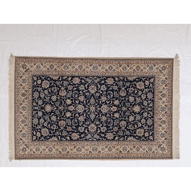 This master piece is a silk and wool pile genuine hand made exceptionally fine Persian Nain carpet signed by a master weaver-
