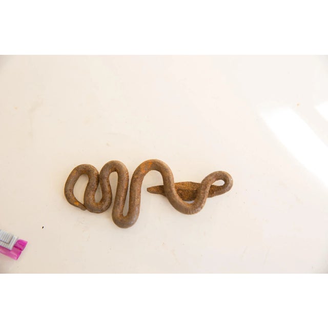 :: Vintage African iron snake. As this item is in vintage condition, it may show signs of age and use. Date made estimated...