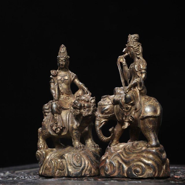 This is a captivating pair of antique gilt bronze sculptures depicting two Bodhisattvas, traditionally associated with...