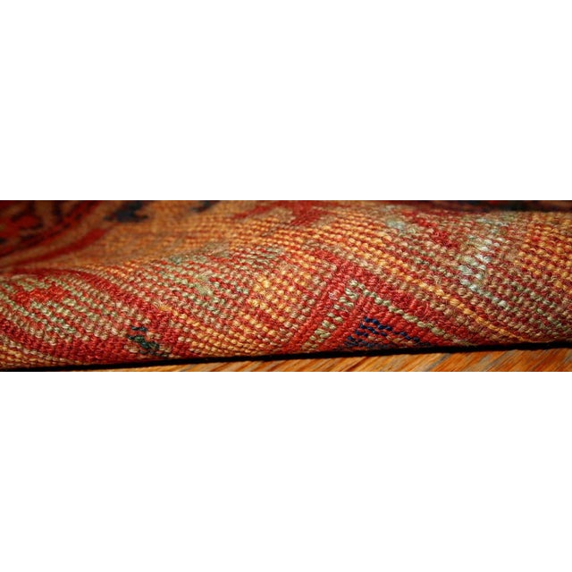 Antique Persian Kurdish rug in traditional design, olive green and yellow shades. The rug is from the end of 19th century,...