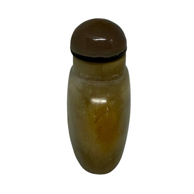 This antique Chinese carved shadow agate snuff bottle dates back to the late 19th century (Qing dynasty). The dark,...