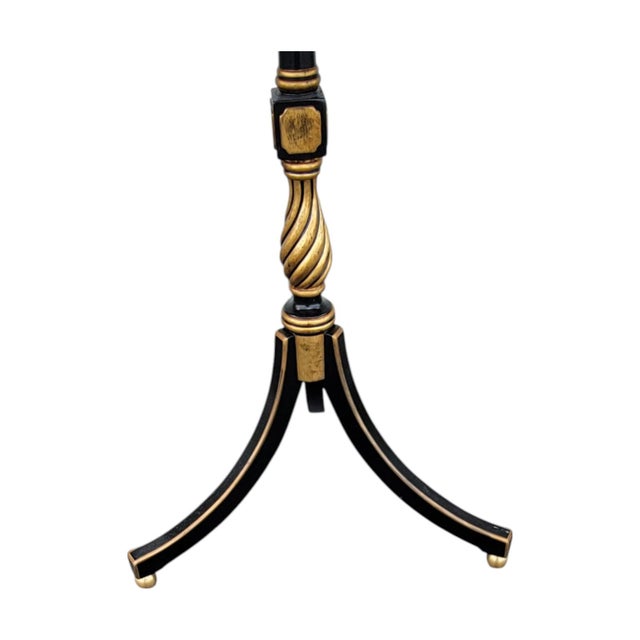 Elevate your space with this elegant Mid-Century Regency style accent table. Featuring a striking rosewood veneer top with...