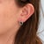Deep London blue topaz gemstones shimmer within a halo of diamonds in these oval studs, crafted in solid 14K yellow gold....