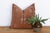 A vertical column of stacked diamonds and arrow motifs runs down the center of this handcrafted Moroccan cactus silk...