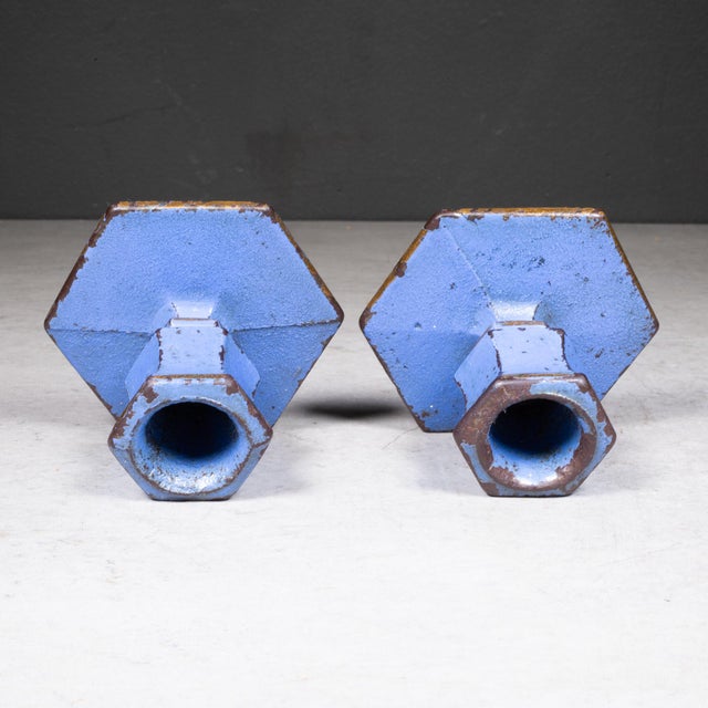 ABOUT A pair of vintage solid steel candlestick holders with hexagonal bases. Blue with gold trim. CREATOR Unknown. DATE...