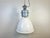 This industrial pendant light was made by elektrosvit in slovakia during the 1990s. It features a white enamel shade and...