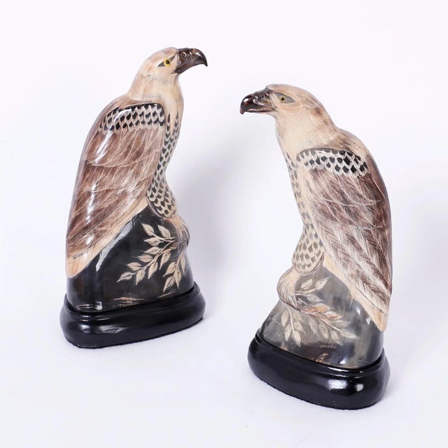 Pair of Chinese vintage carved and painted horn eagles or hawks with an alluring, stylized interpretation of these...