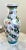 This hand-painted Chinese porcelain vase features a dramatic dragon motif wrapped in clouds and flame scrolls—rich in...