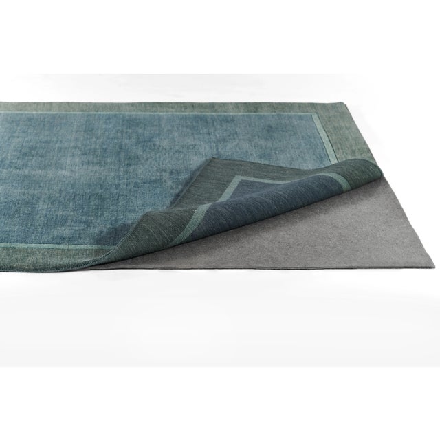 Premium cushioned, high performance non-slip pad with recycled needle-punched fiber Textured rubber backing for improved...