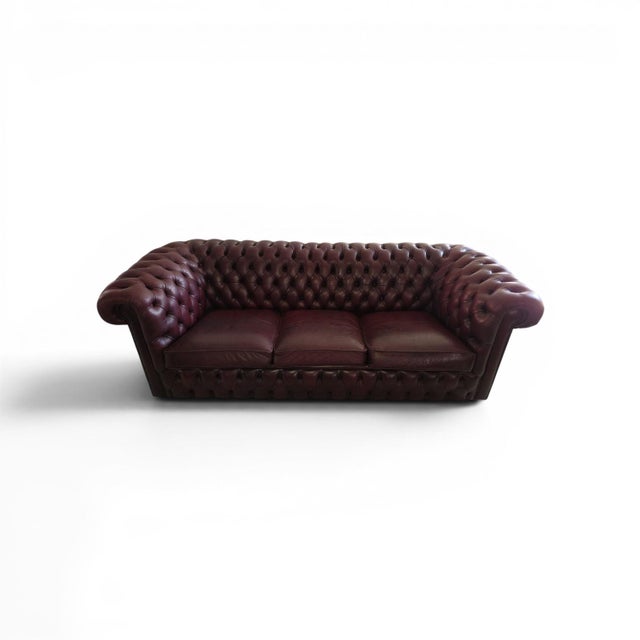 Genuine leather with deep button tufting Traditional Chesterfield with rolled arms and studded detailing Beautiful vintage...