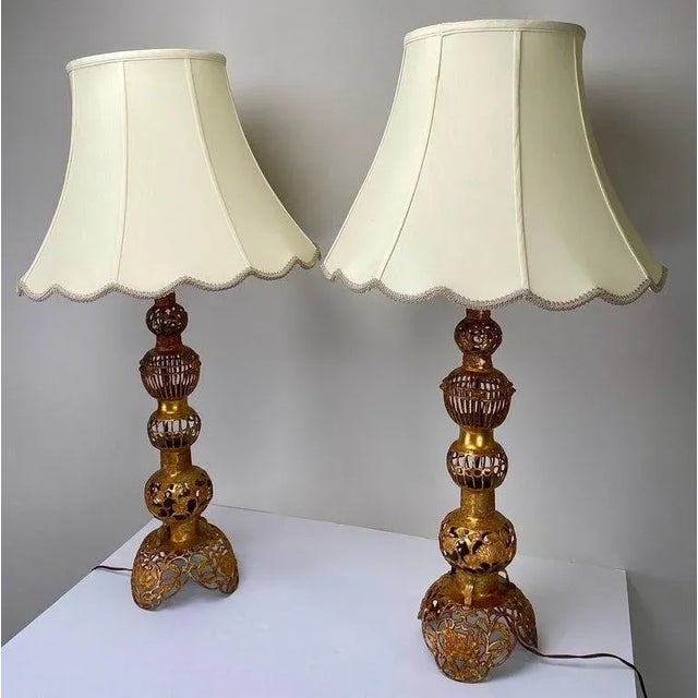 A striking pair of Hollywood Regency Chinese-style table lamps, exuding opulence and grace. Crafted with meticulous...
