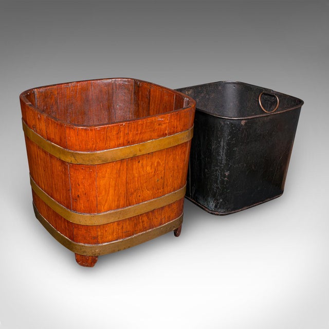 This is an antique fireside store. An English, mahogany and brass banded coal or log bin, dating to the late Victorian...
