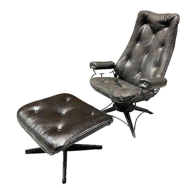 1953 Model 90 "Riviera" high back black wrought iron springer Lounge Chair with matching ottoman by Homecrest. The chair...