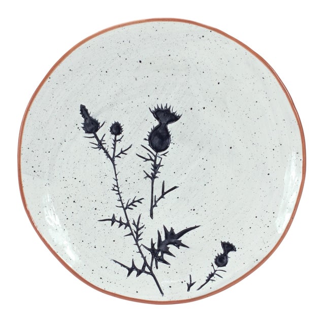 Add a charming touch of rustic elegance to your dining experience with this set of four Rustic Thistle Etched Ceramic...