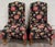 This is an elegant vintage pair of Queen Anne style wingback lounge chairs featuring graceful pad feet, turned stretchers,...