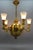 Art Deco brass, bronze, and frosted glass five-light figural chandelier from ca. 1920, Germany. This impressive Art Deco...