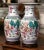 Add color and refinement to a mantel, console, or pair of side tables with this elegant pair of vintage Chinese porcelain...