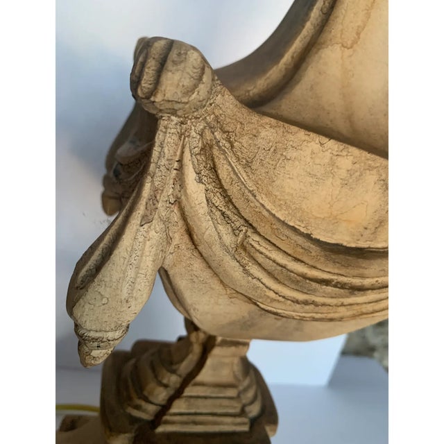 Hand carved, distressed wood neoclassical urn table lamp. This wonderful lamp is finished in an old world distressed...