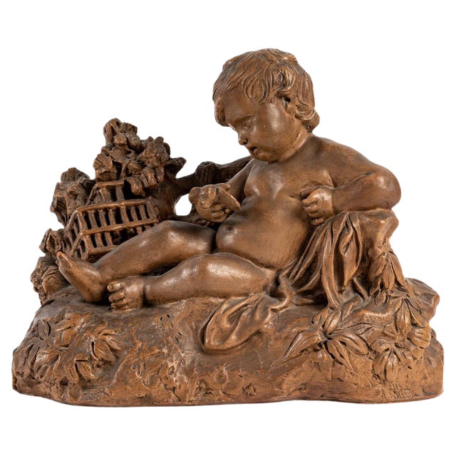 Terracotta Figurine of Child with Bird For Sale