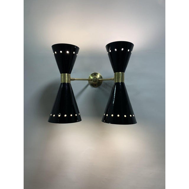 “diablo” brass wall lamps – italy, 1950s a pair of elegant vintage “diablo” wall lamps, made of brass in the 1950s and...