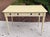 Distressed painted writing computer desk by Hooker Furniture. Pale yellow with carved detailed legs. The middle drawer...