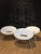 White plastic ploof, scoop chair made of plastic with aluminum legs. Use as a desk chair, accent chair or outdoors on the...
