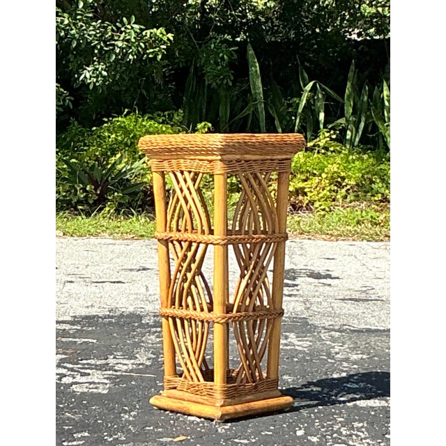 Add a touch of coastal charm to your space with this stunning woven rattan pedestal. Perfect for displaying plants,...