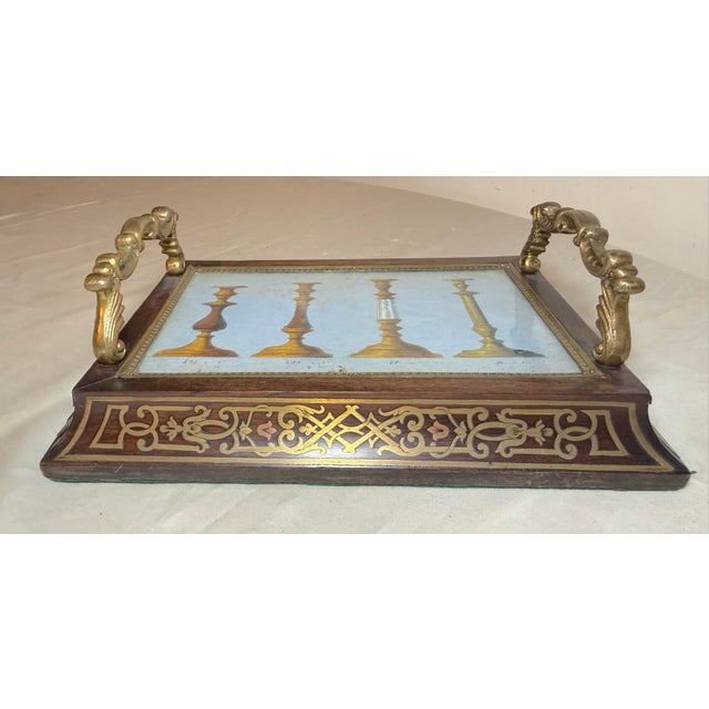 This antique 19th century French wood and brass boulle vanity tray is a luxurious and collectible piece that exudes...
