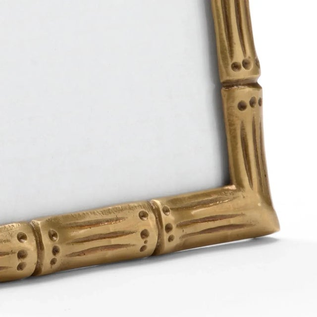 Display your favorite 5"x7" photograph in our Brass Bamboo Frame. This antique brass picture frame with bamboo design...