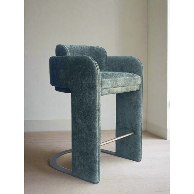 Elevate your kitchen with our Indigo Upholstered Counter Chair in green. Sink into the luxurious gray chenille velvet...