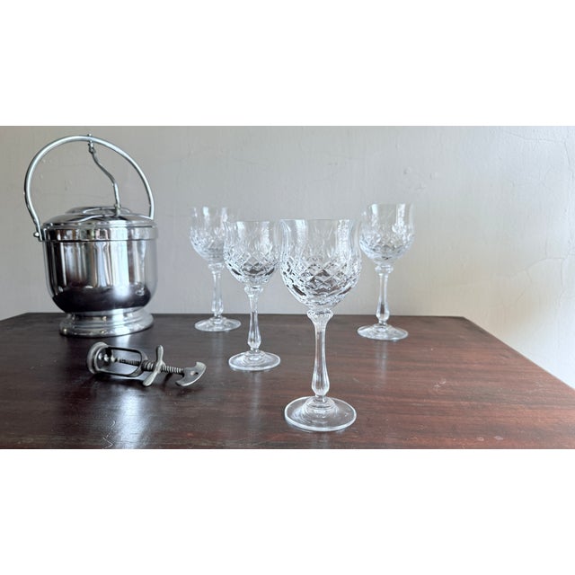 Set of nine Mikasa Chateau crystal goblets, featuring an ornate cut bowl and fluted stem. Made of heavy lead crystal,...