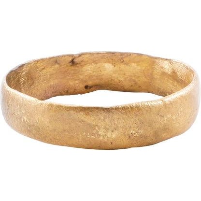 Late 9th-early 11th century AD. Gilt bronze, size 10 ¾. 5.0mm width band with low rounded face. Made with a core filling...