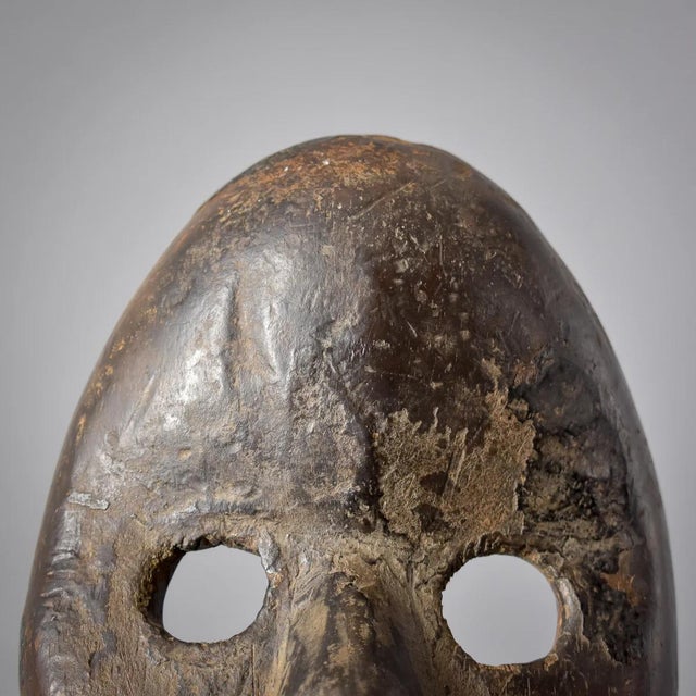 Dan masks, originating from the Dan people of Liberia, CÃ´te d'Ivoire, and Guinea, are recognized for their elongated...
