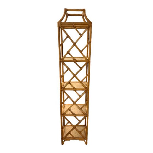 Elegant vintage bamboo étagère featuring five woven rattan shelves, a warm honey-toned finish, and decorative X-shaped...