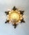 Decorative german flush-mount ceiling light dating from the 1970s. The fixture features an ornate wrought-iron frame with...